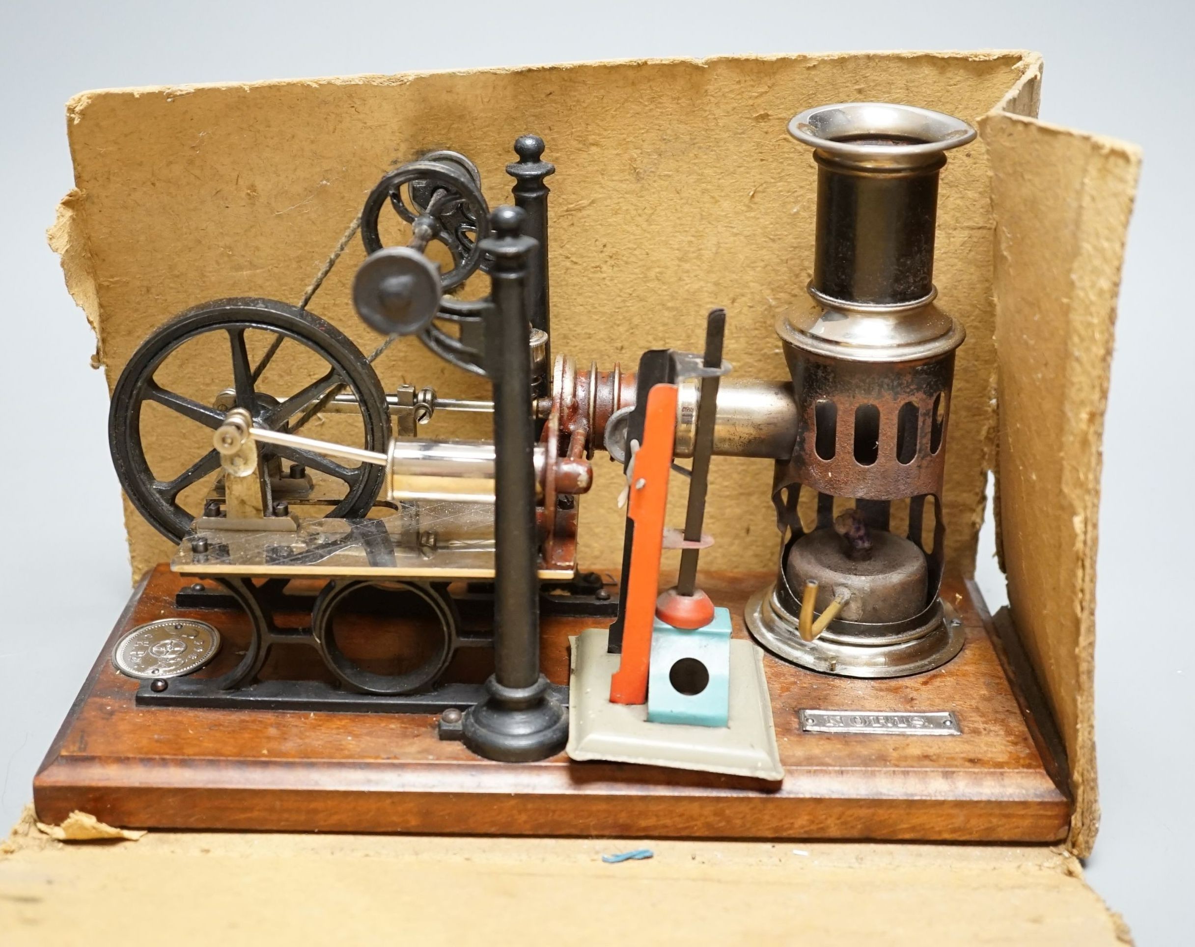 A boxed Ernst Plank hot air engine, 25 cms wide x 16 cms high.